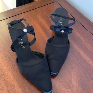 Like New- Black satin heels with bow/pearl detail. Worn twice …. Very classic!